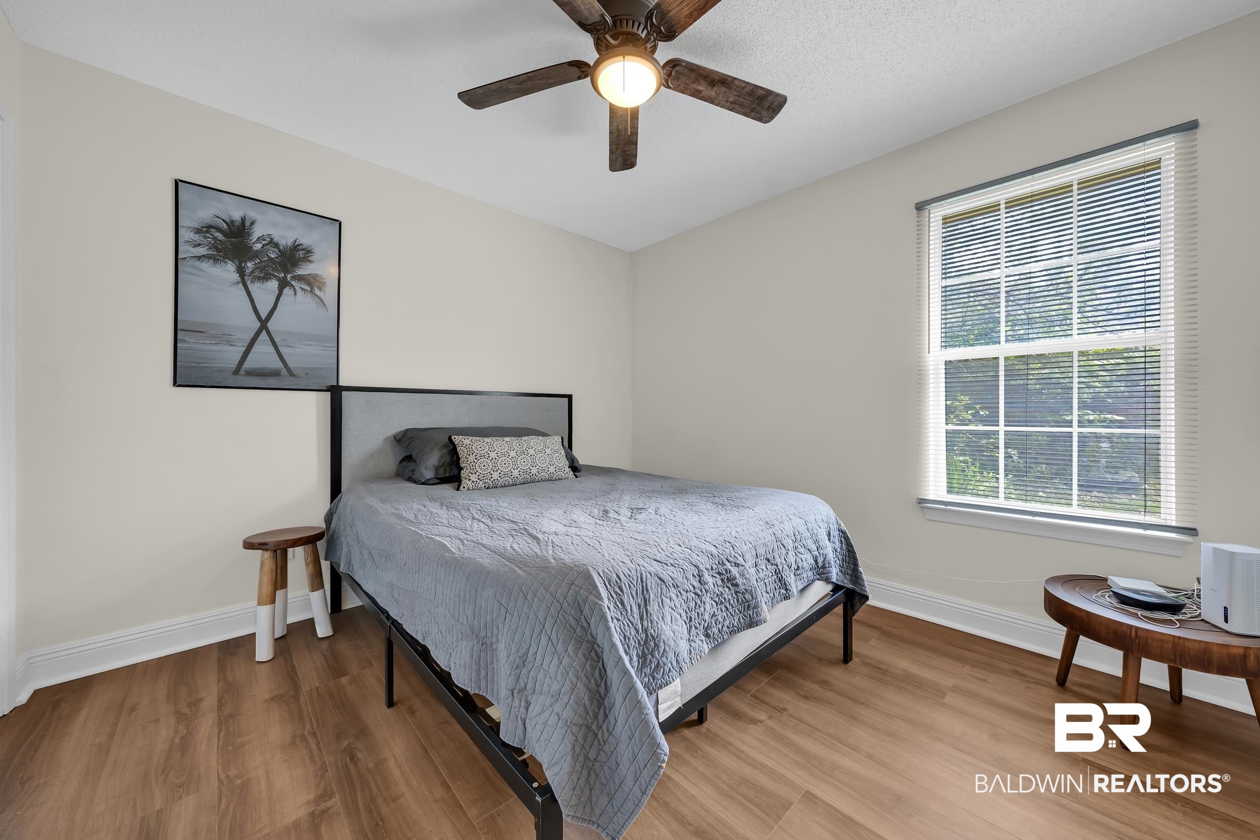 509 Loblolly Court Foley, AL 36535 - Photo 17 of 26 Spacious room featuring wood-finish flooring, a window with venetian blinds, and a ceiling fan with integrated lighting