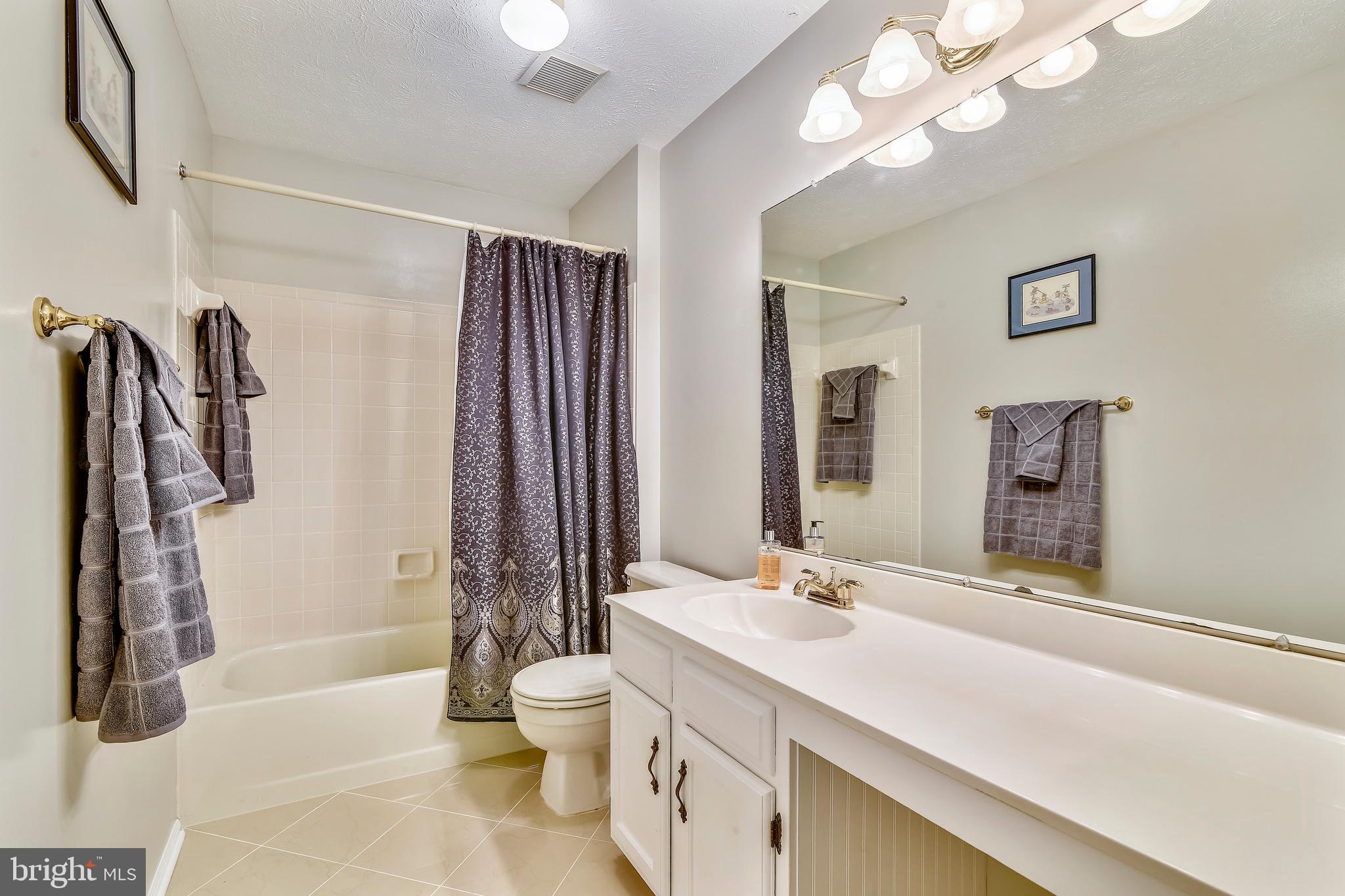103 Rector Street Sterling, VA 20164 - Photo 17 of 25 Hall bath has tub w/tile surround & linen closet