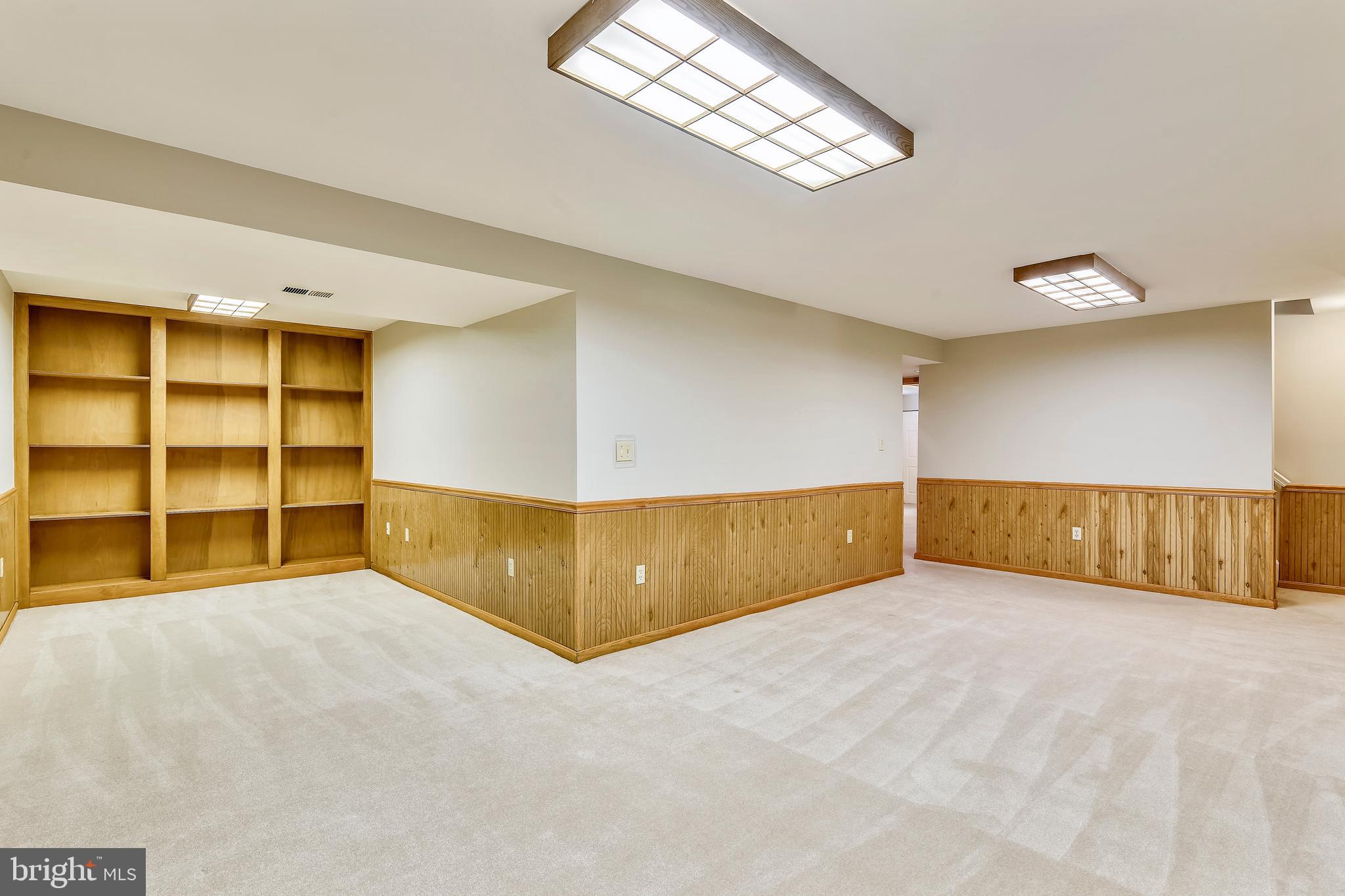 103 Rector Street Sterling, VA 20164 - Photo 20 of 25 Lower level rec room with built in shelves