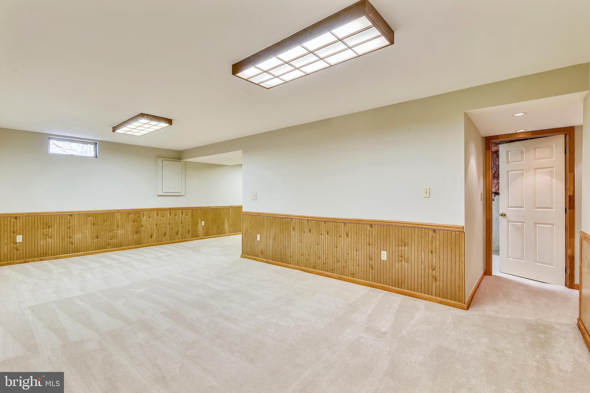 103 Rector Street Sterling, VA 20164 - Photo 21 of 25 Lower level rec room with door to utility room
