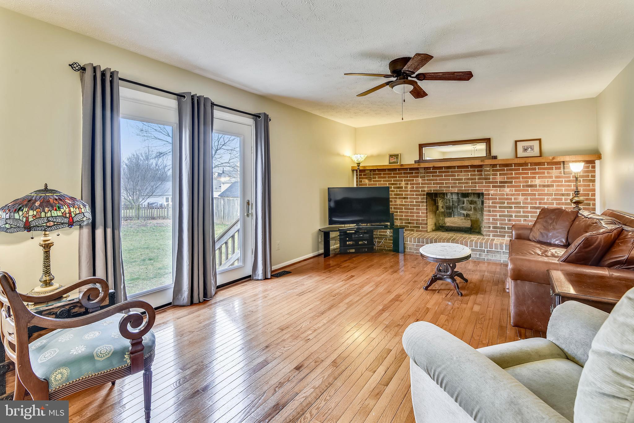 103 Rector Street Sterling, VA 20164 - Photo 8 of 25 Family room with wood burning fireplace & mantel