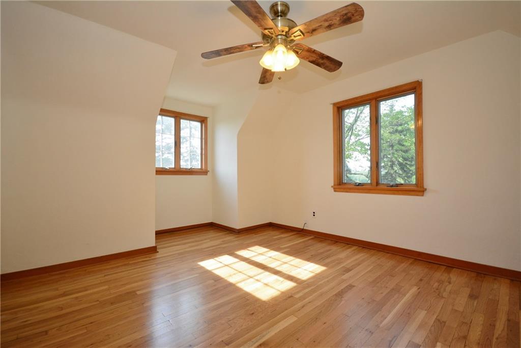 3201 Provost Road Pittsburgh, PA 15227 - Photo 14 of 25 This is one of two upstairs bedrooms. Notice the great daylight from the well placed windows, and a ceiling fan to keep you cool. There is a large closet and access to storage under the rear eave of the house.