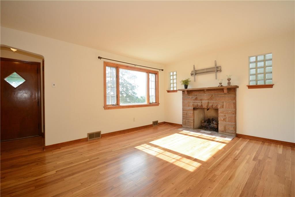 3201 Provost Road Pittsburgh, PA 15227 - Photo 4 of 25 The stone fireplace in the living room is already equipped with gas logs and above the mantel are brackets to mount your TV. All freshly painted in a neutral cream.