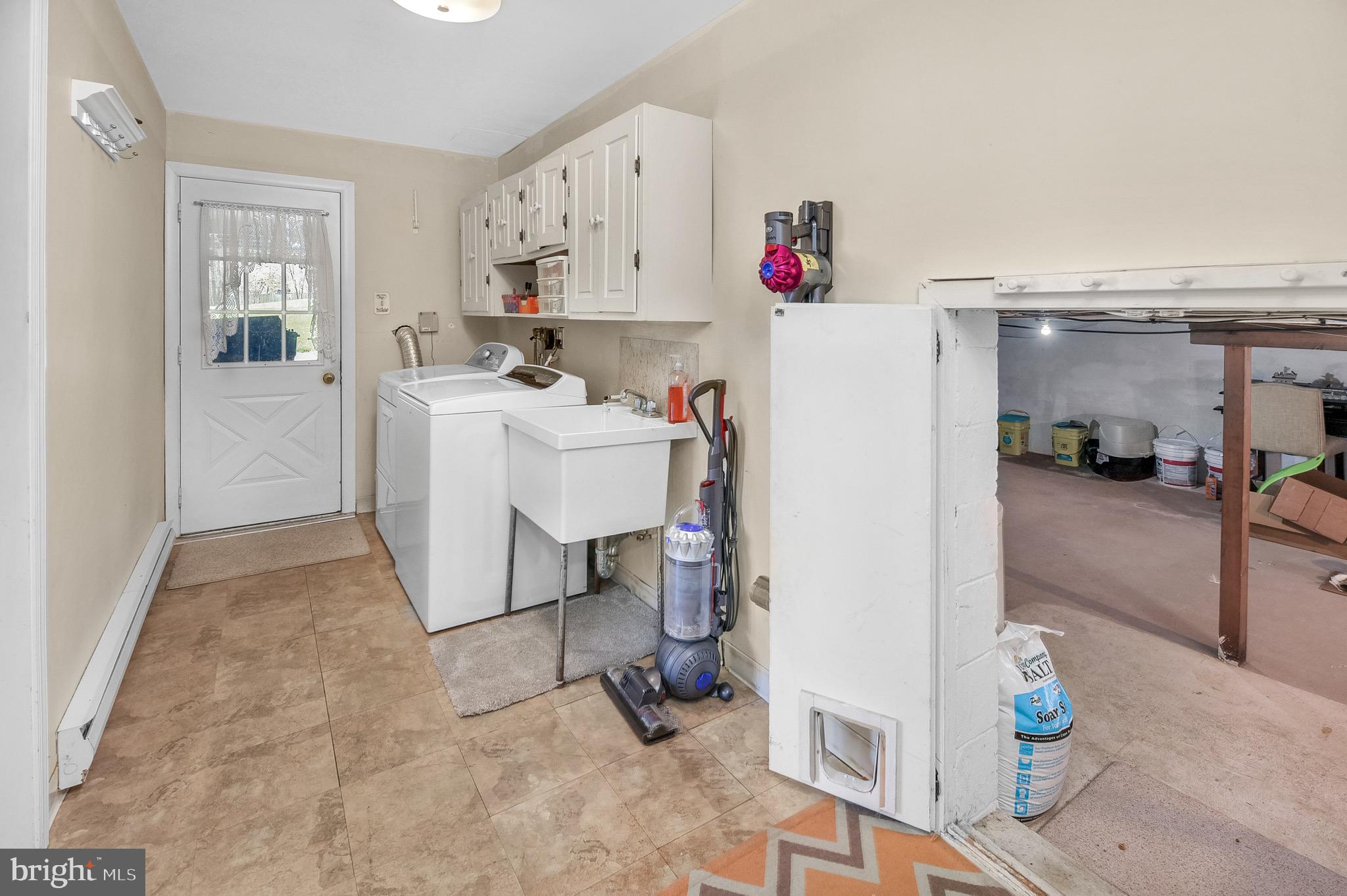 3 Deerpath Road Chalfont, PA 18914 - Photo 23 of 32 Laundry room with entry to garage and storage acce