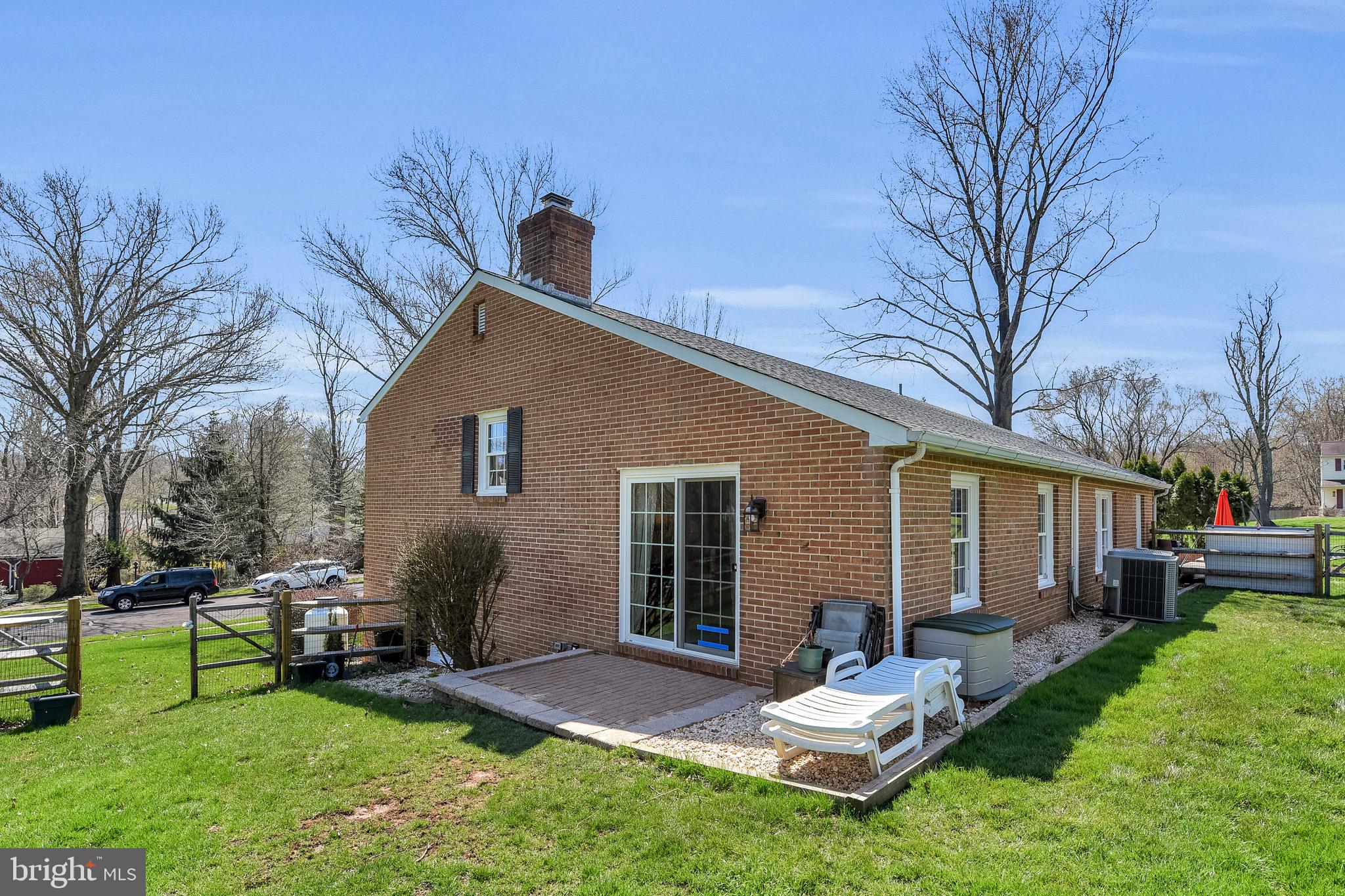 3 Deerpath Road Chalfont, PA 18914 - Photo 30 of 32 Patio off of living room, enters inside of gated y