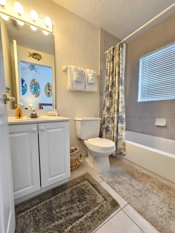 a bathroom with a toilet a sink and a bathtub