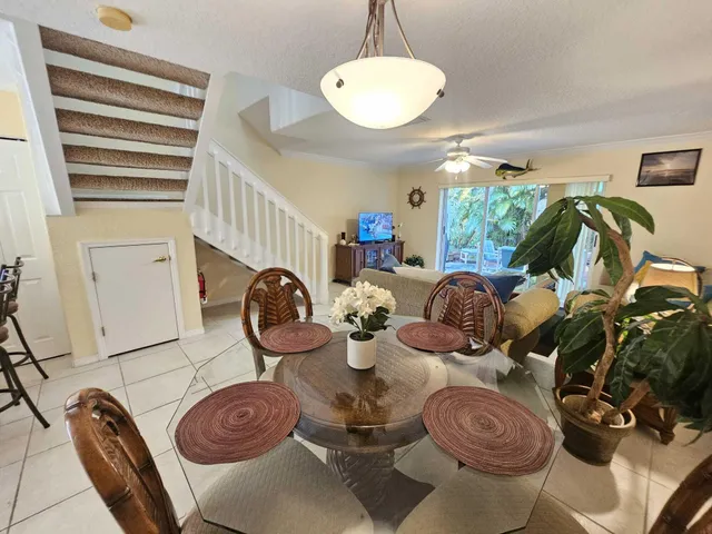 a very nice looking dining room with furniture