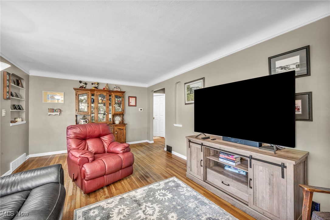 3285 Stoney Ridge Road Avon, OH 44011 - Photo 20 of 43 Living room with light wood-type flooring and baseboards