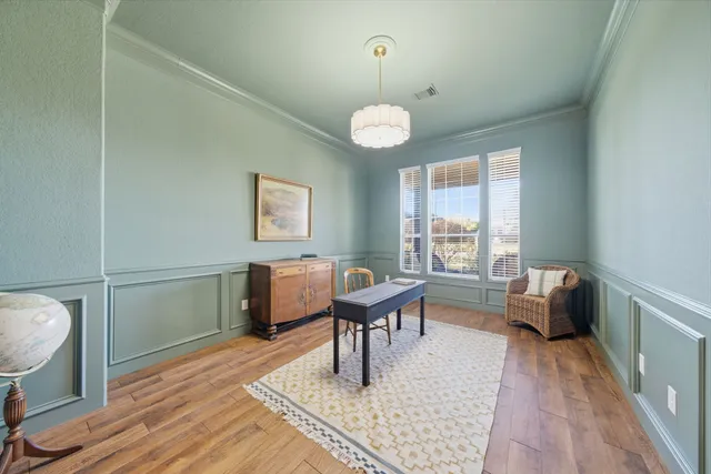 a dining room with furniture window wooden floor