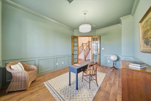 a living room with furniture a window and a table