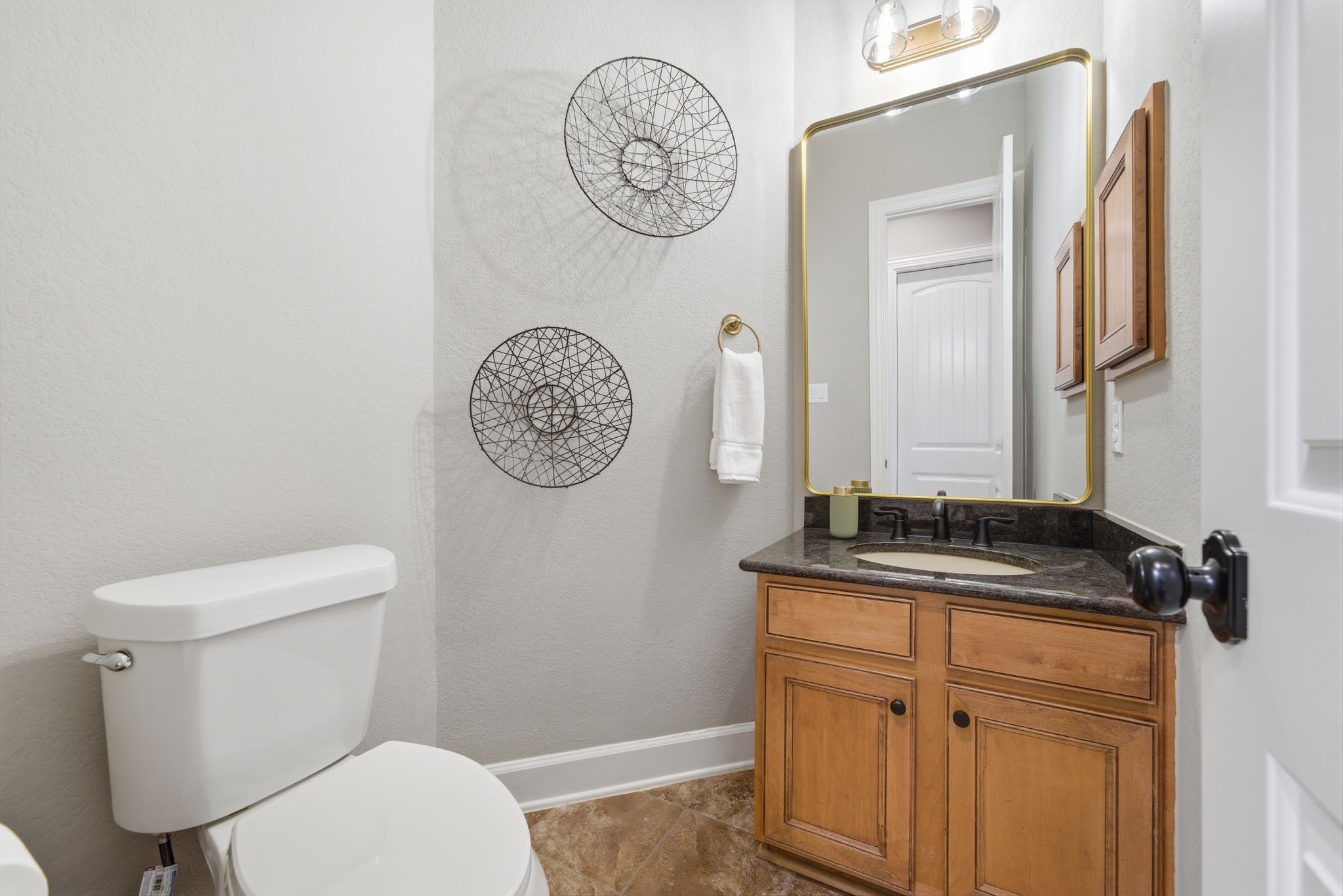 32807 Whitburn Trail Fulshear, TX 77441 - Photo 20 of 39 a bathroom with a toilet a sink and a mirror