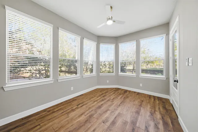 a bathroom with a toilet a sink and a mirror