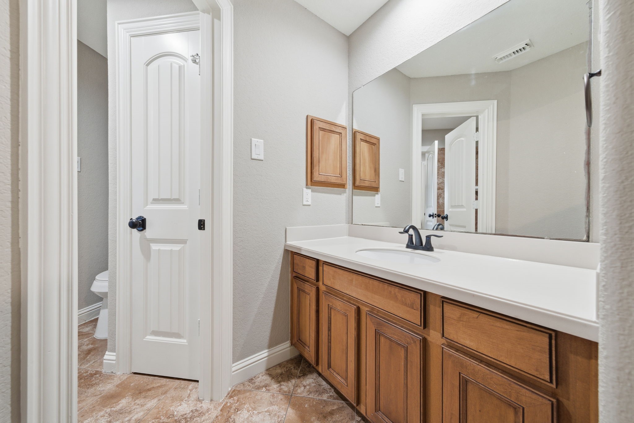 32807 Whitburn Trail Fulshear, TX 77441 - Photo 27 of 39 a bathroom with a double vanity sink and mirror