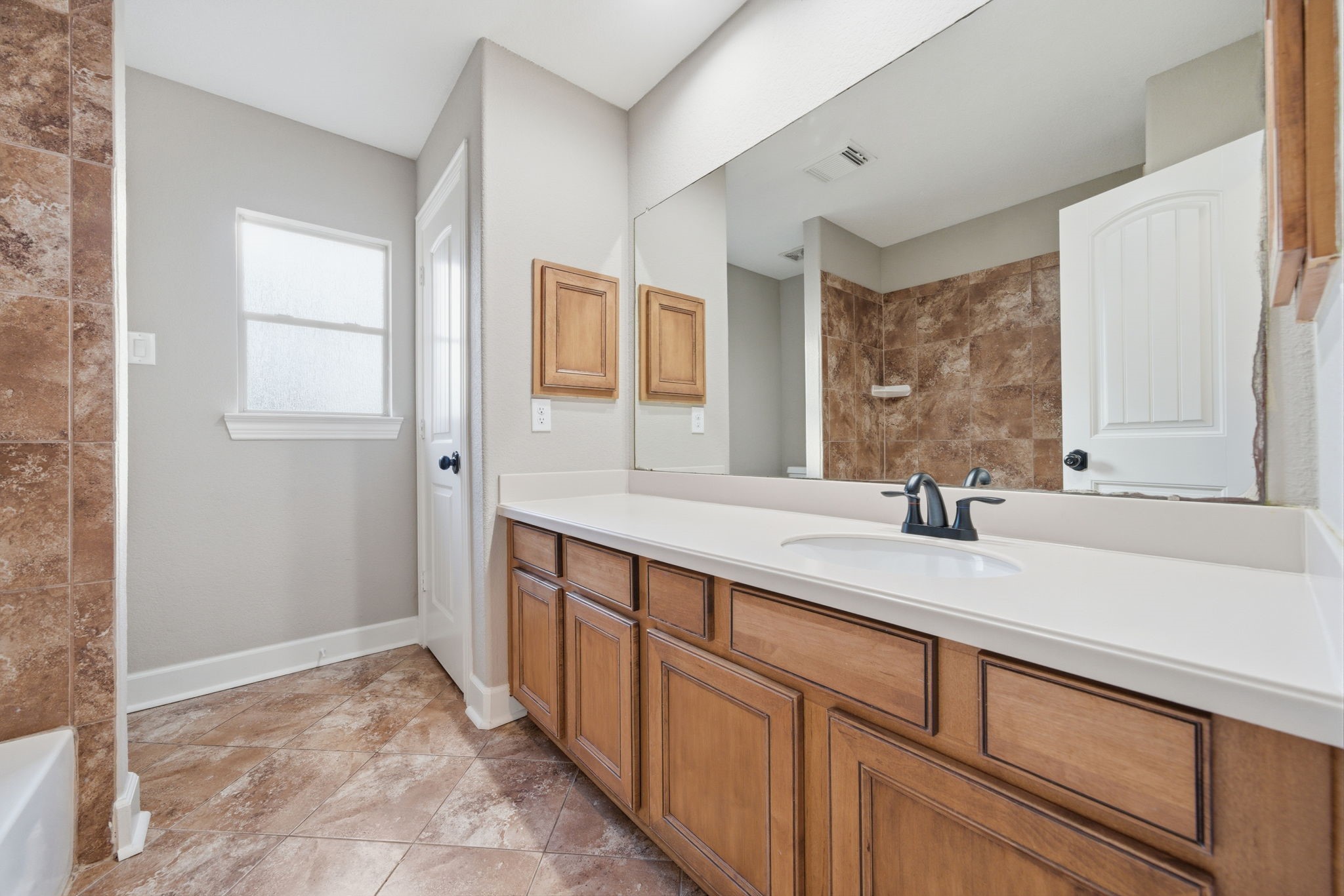 32807 Whitburn Trail Fulshear, TX 77441 - Photo 31 of 39 a bathroom with a sink and a mirror