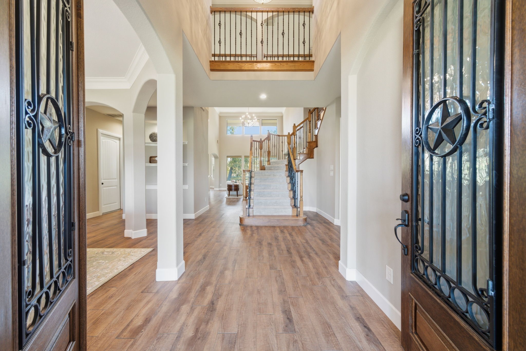 32807 Whitburn Trail Fulshear, TX 77441 - Photo 3 of 39 a view of a hallway with wooden floor and staircase