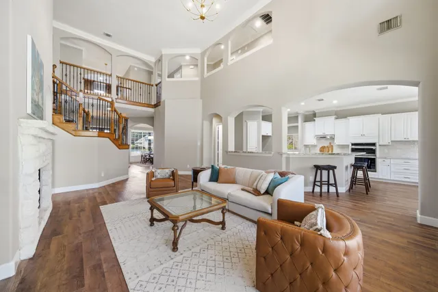 a living room with furniture and a fireplace