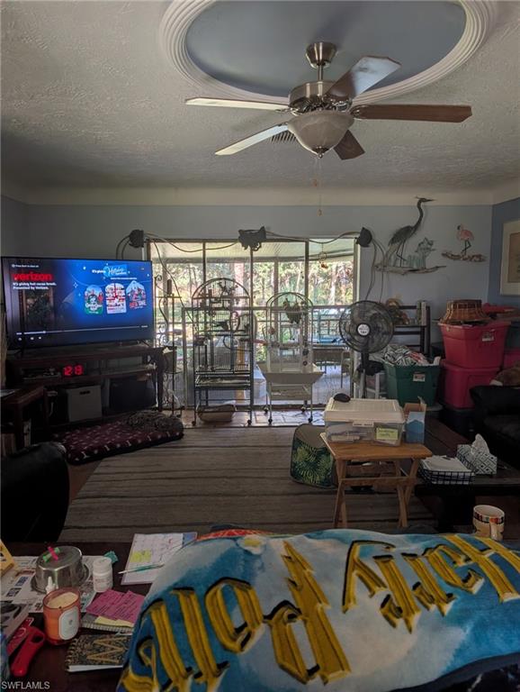 23261 Tuckahoe Road Alva, FL 33920 - Photo 27 of 39 a living room with lots of furniture and a flat screen tv