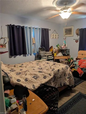 a living room with lots of furniture and a flat screen tv