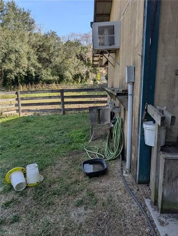 a view of backyard with outdoor seating and covered with green space
