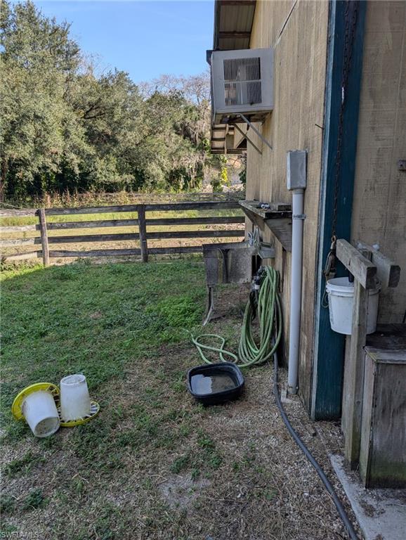 23261 Tuckahoe Road Alva, FL 33920 - Photo 36 of 39 a view of a backyard with plants and a grill