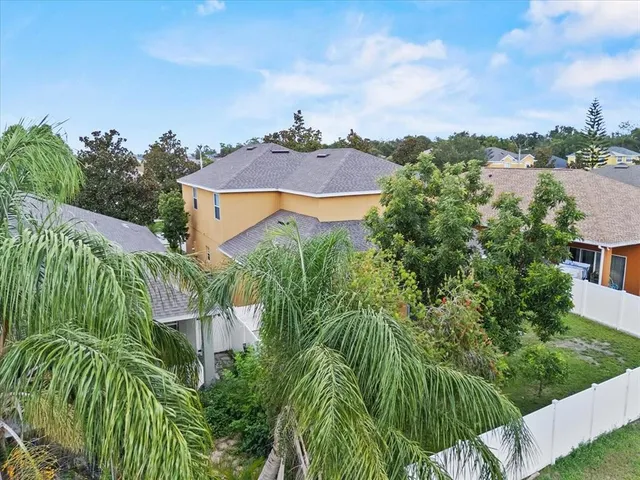 an aerial view of a house with a garden