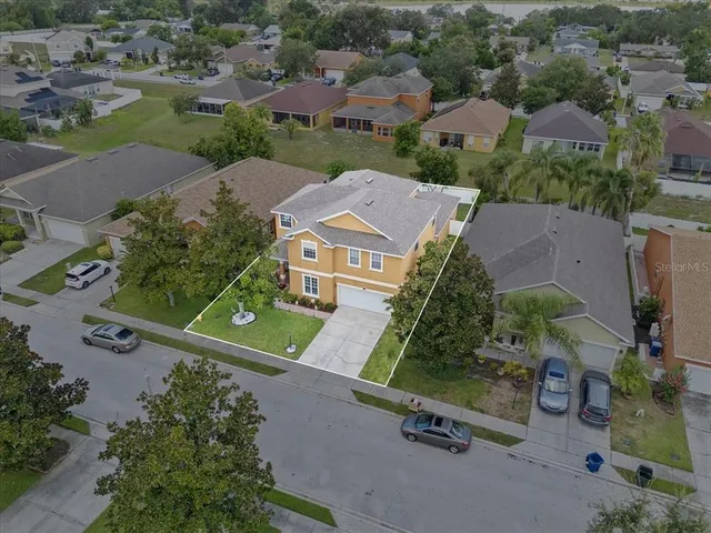 a view of a workspace with furniture and wooden floor