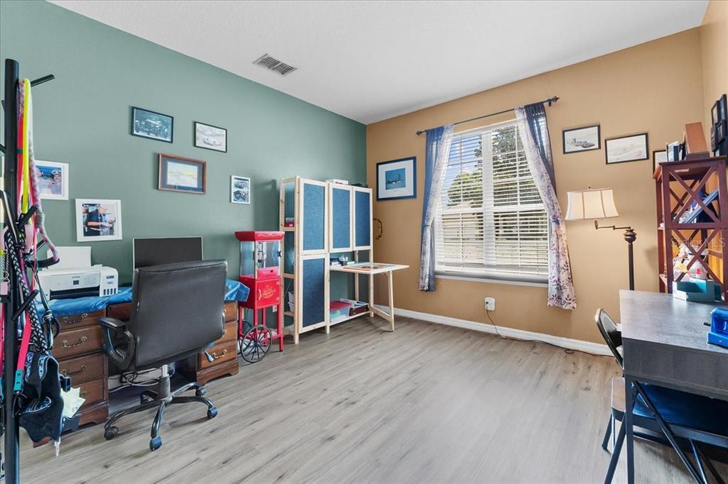 817 James Way Lake Alfred, FL 33850 - Photo 21 of 69 a view of a livingroom with workspace and a window