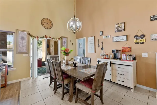 a living room with furniture large window and flat screen tv