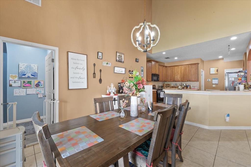 817 James Way Lake Alfred, FL 33850 - Photo 25 of 69 a view of a dining room with furniture and wooden floor
