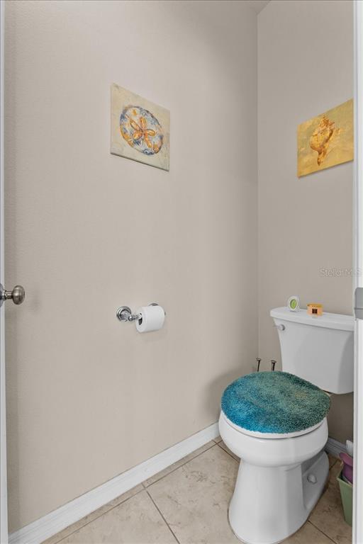 817 James Way Lake Alfred, FL 33850 - Photo 38 of 69 a white toilet sitting next to a white tub