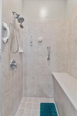 a living room with furniture ceiling fan and a window