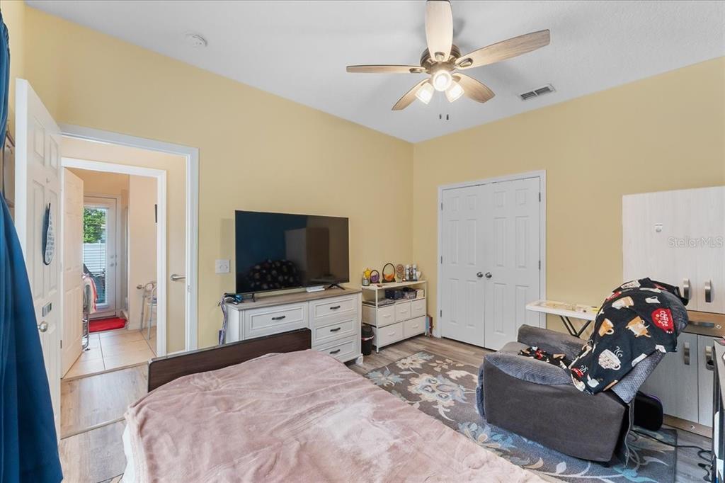 817 James Way Lake Alfred, FL 33850 - Photo 43 of 69 a bedroom with a bed and a flat screen tv