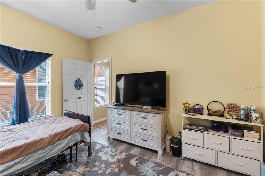 817 James Way Lake Alfred, FL 33850 - Photo 44 of 69 a bedroom with a bed and a flat tv screen on dresser