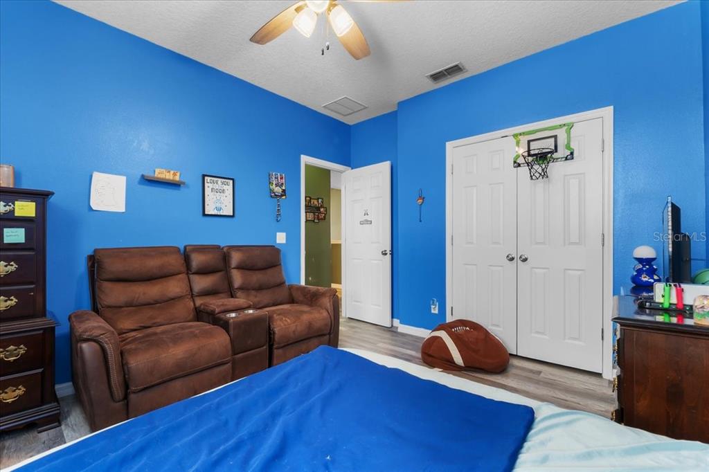 817 James Way Lake Alfred, FL 33850 - Photo 49 of 69 a living room with furniture and a wooden floor