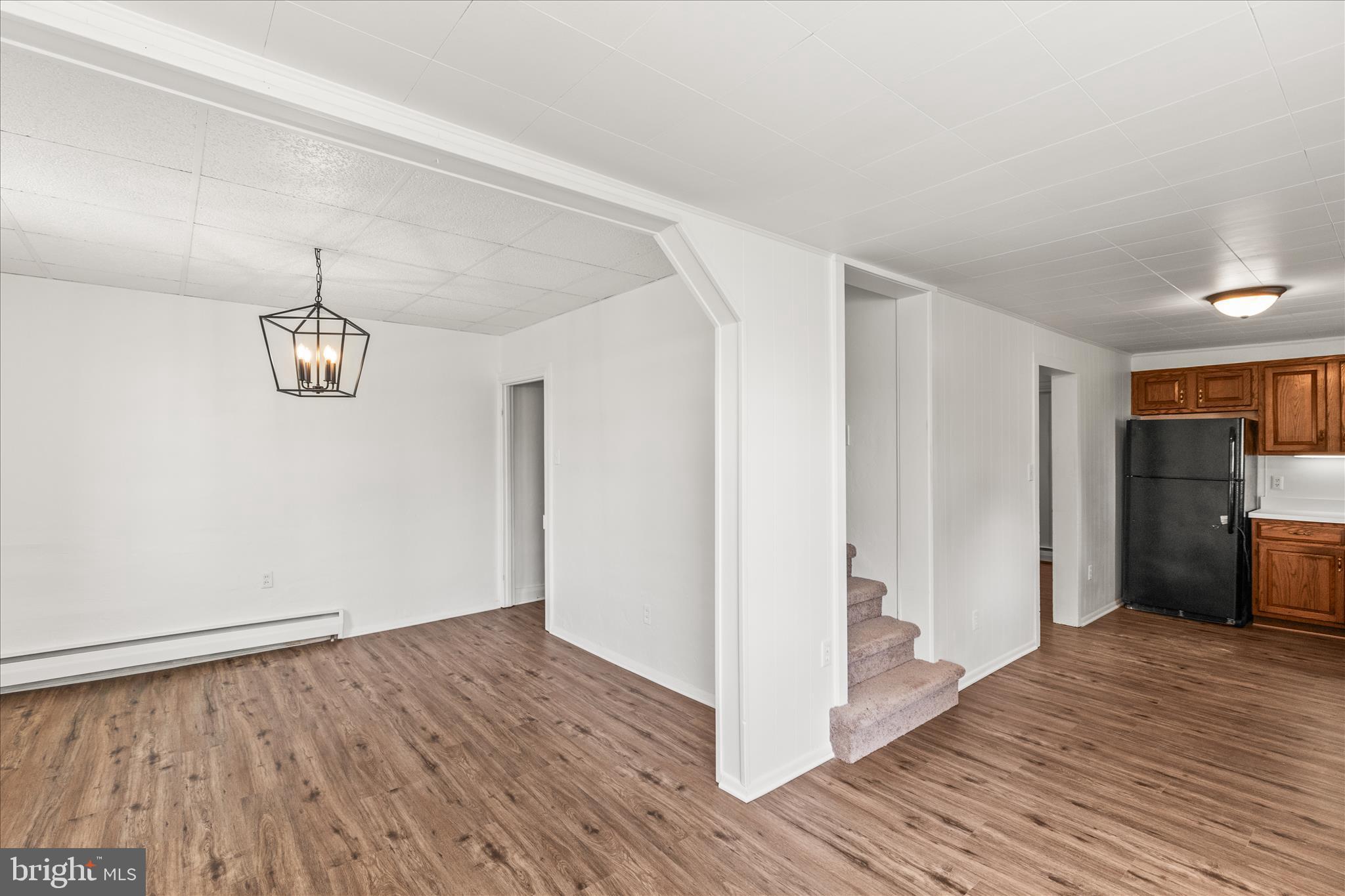 310 Clover Lane Hanover, PA 17331 - Photo 12 of 34 a view of an empty room with wooden floor and a window