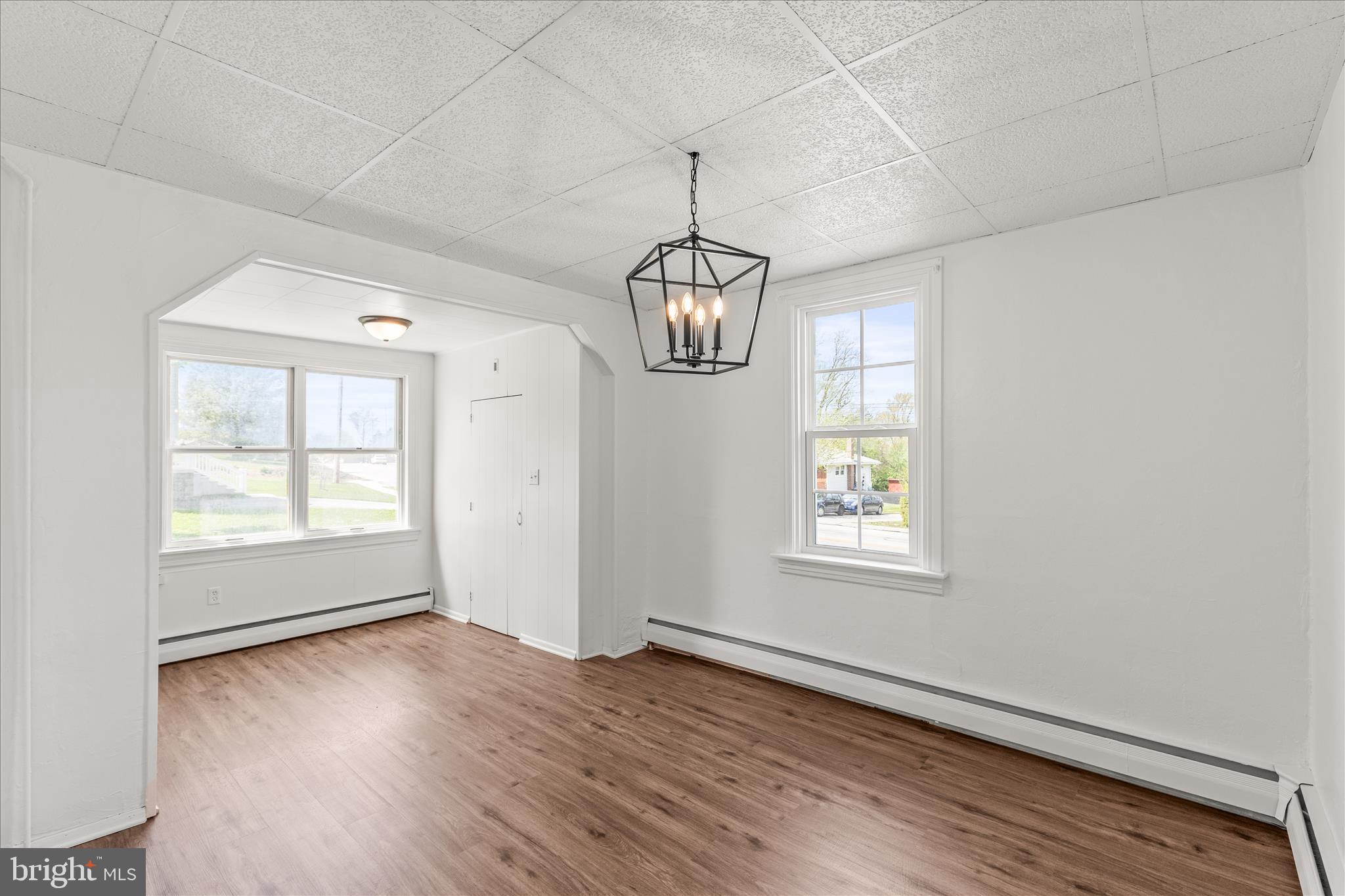 310 Clover Lane Hanover, PA 17331 - Photo 14 of 34 an empty room with wooden floor and windows