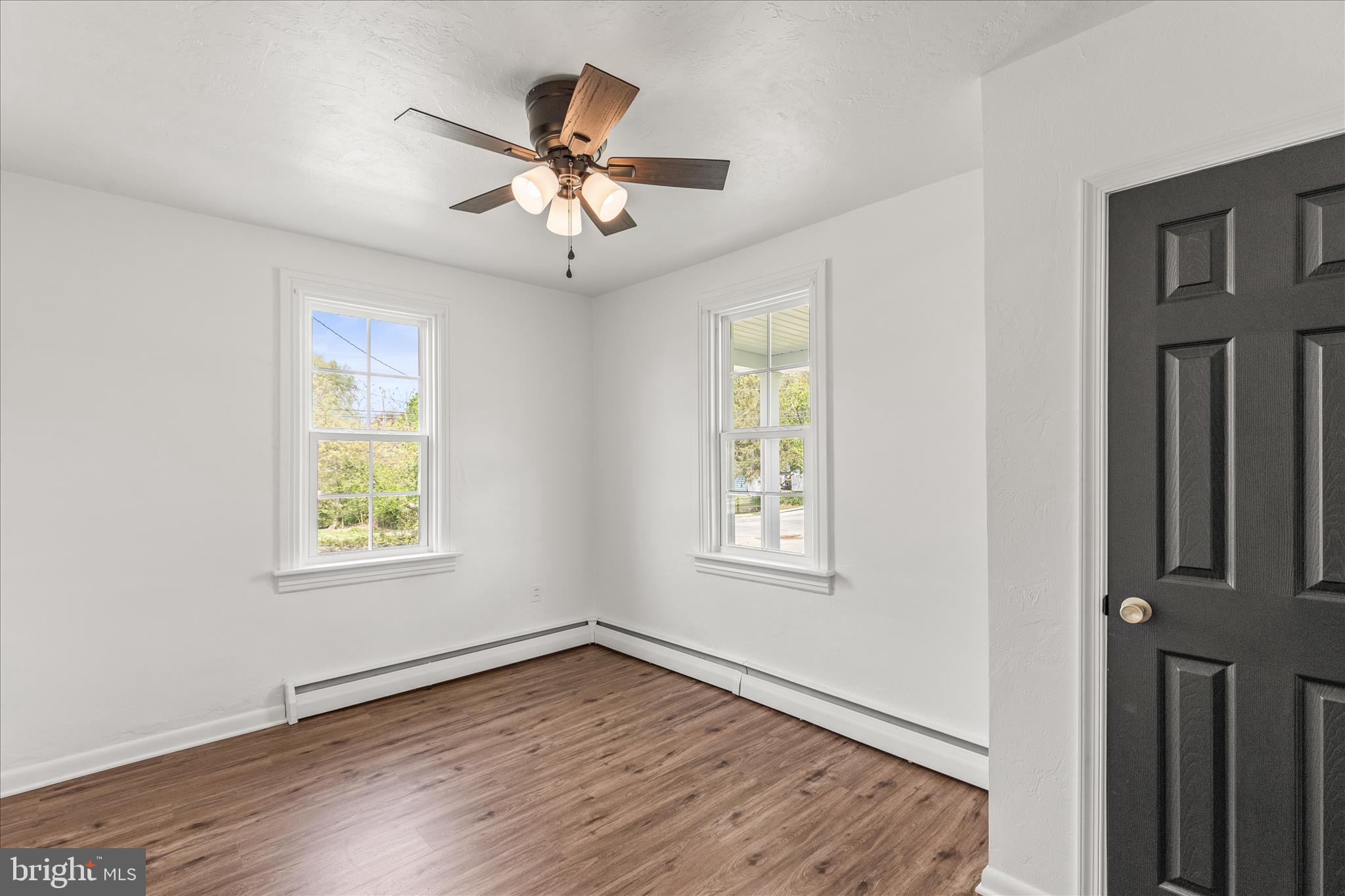 310 Clover Lane Hanover, PA 17331 - Photo 17 of 34 a view of an empty room with wooden floor and a window