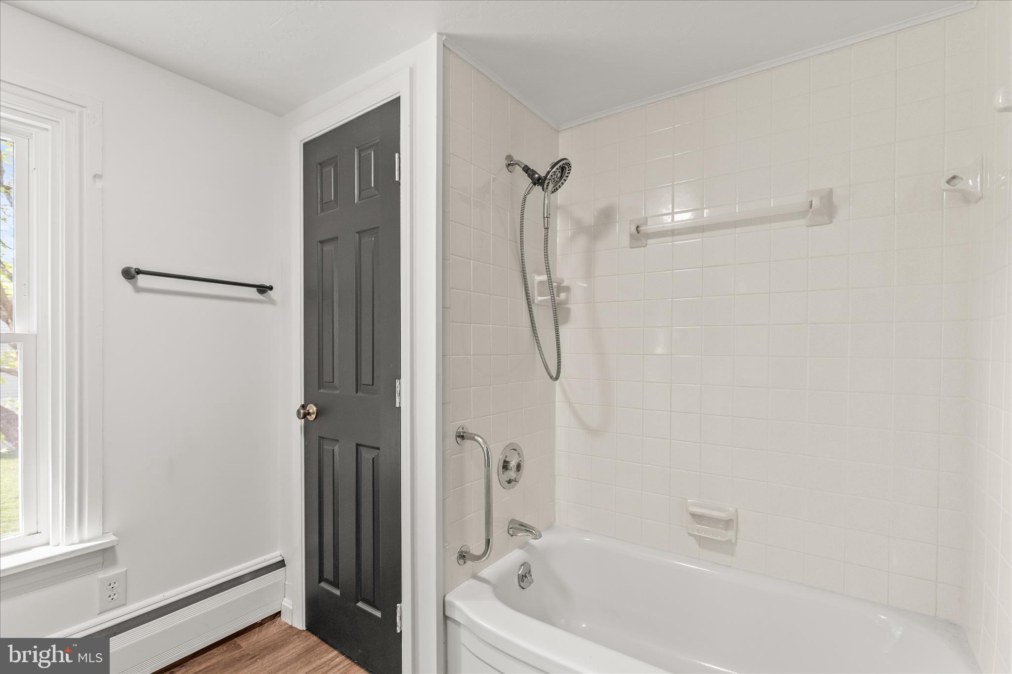 310 Clover Lane Hanover, PA 17331 - Photo 26 of 34 a bathroom with a bathtub a window and a shower