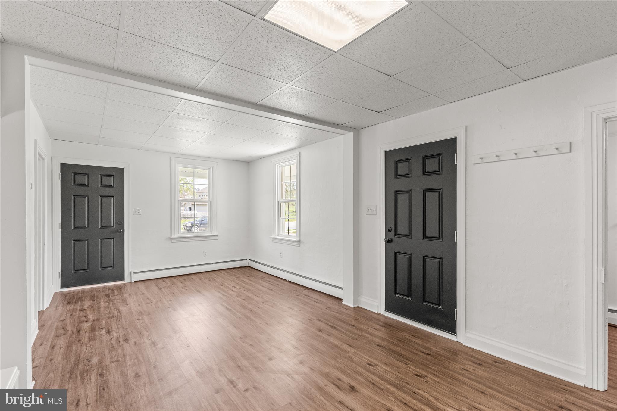 310 Clover Lane Hanover, PA 17331 - Photo 7 of 34 an empty room with wooden floor and windows