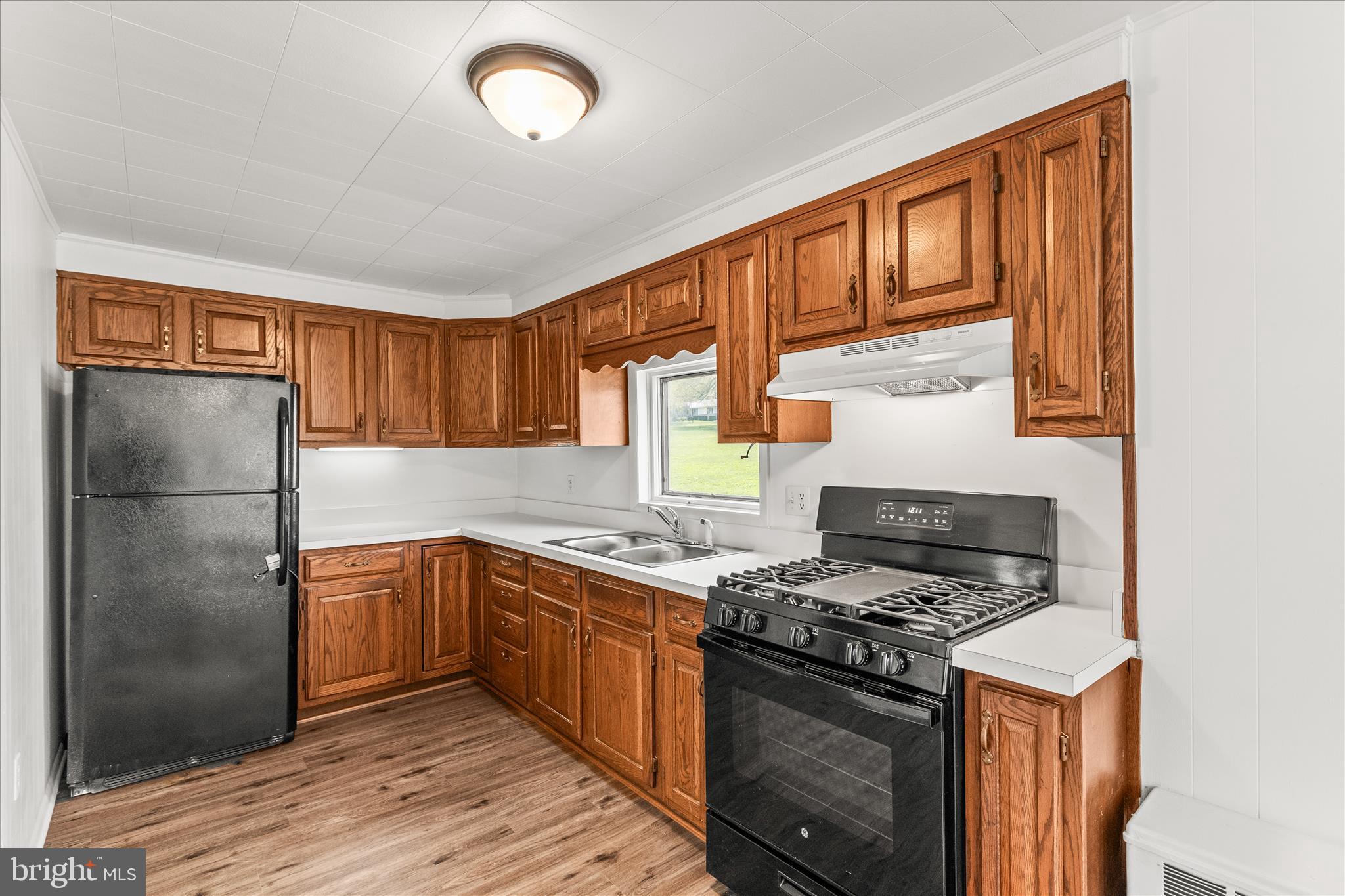 310 Clover Lane Hanover, PA 17331 - Photo 9 of 34 a kitchen with stainless steel appliances granite countertop a stove a refrigerator and a sink