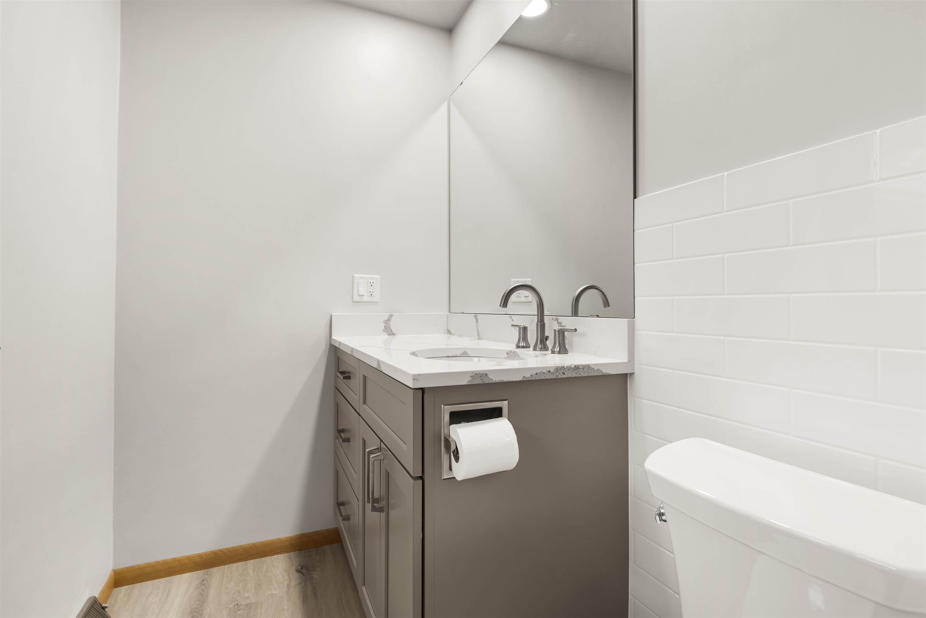 904 Roxbury Road Rockford, IL 61107 - Photo 18 of 35 a bathroom with a sink a toilet and a mirror