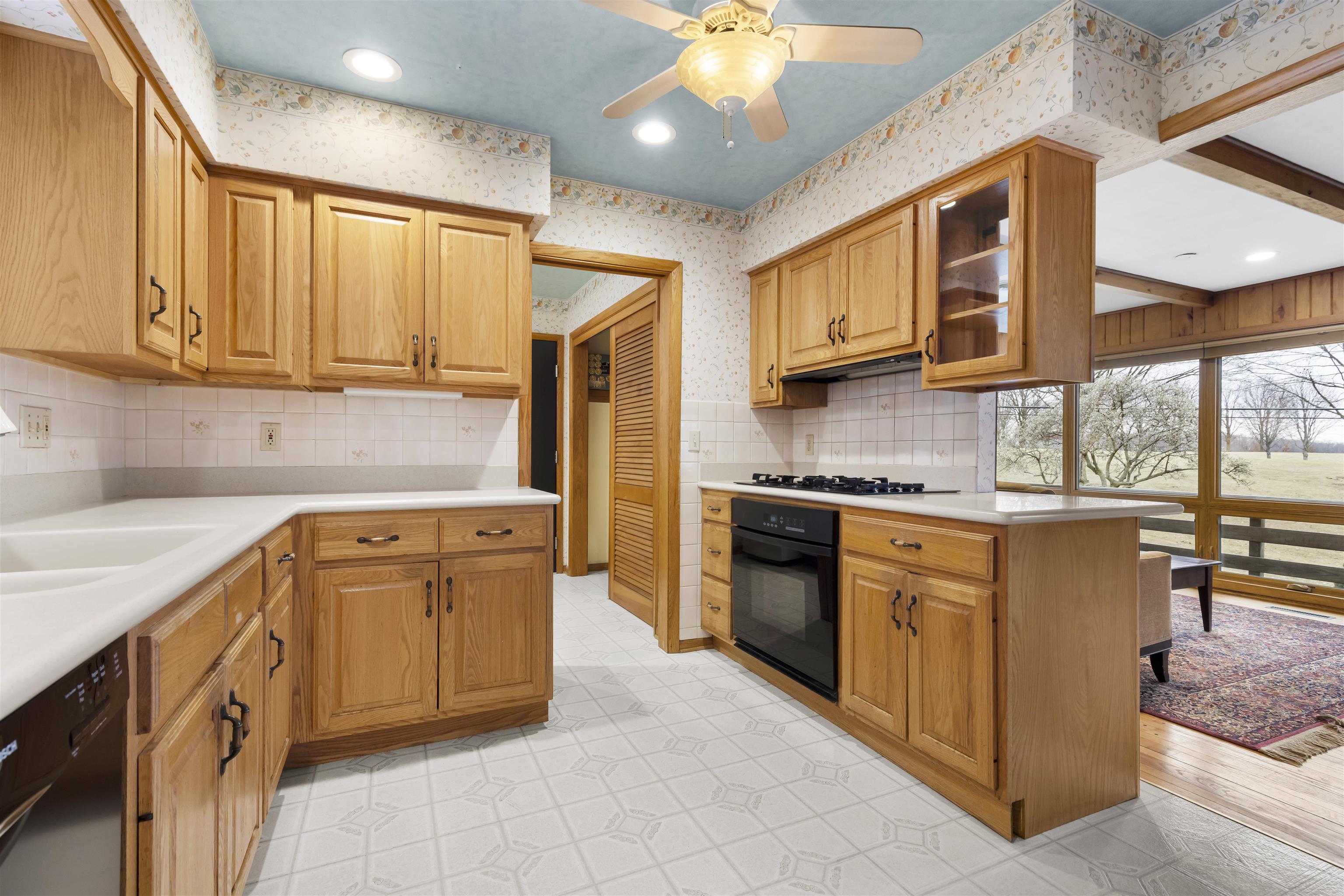 904 Roxbury Road Rockford, IL 61107 - Photo 10 of 35 a kitchen with stainless steel appliances granite countertop a sink a stove and a refrigerator