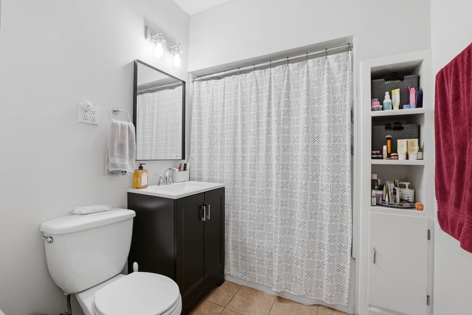 4327 North Avers Avenue Chicago, IL 60618 - Photo 17 of 33 a bathroom with a toilet a sink and curtain