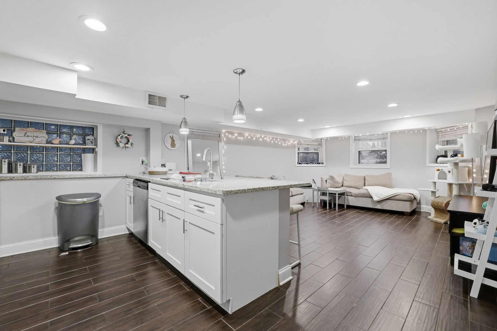 4327 North Avers Avenue Chicago, IL 60618 - Photo 19 of 33 a open kitchen with a sink dishwasher a dining table and chairs with wooden floor