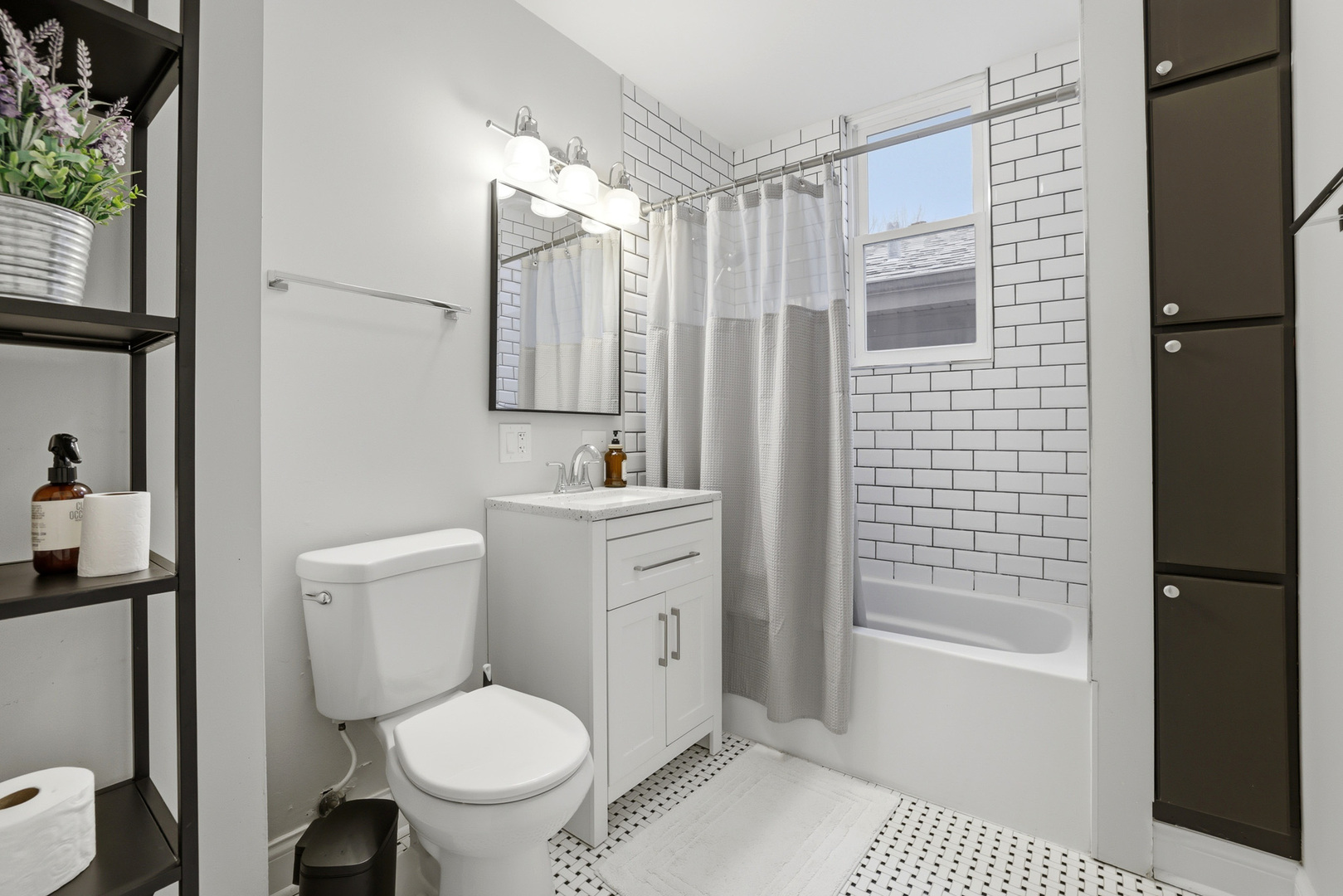 4327 North Avers Avenue Chicago, IL 60618 - Photo 5 of 33 a bathroom with a toilet sink vanity and shower