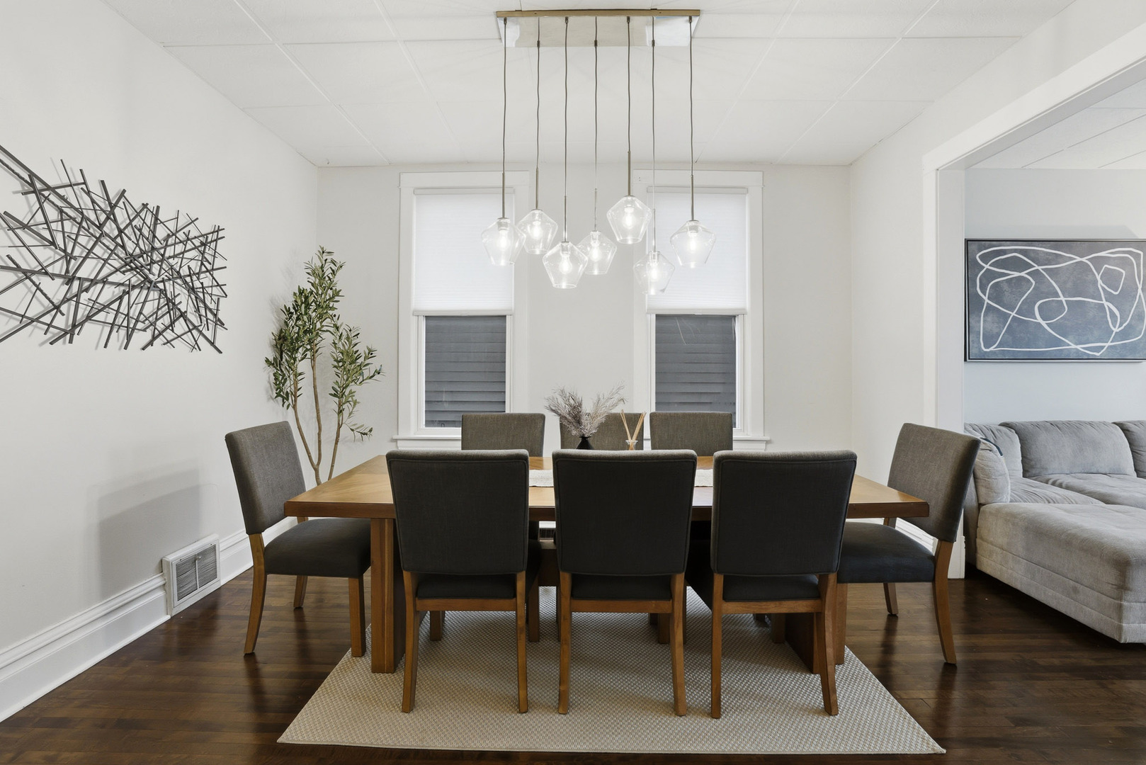 4327 North Avers Avenue Chicago, IL 60618 - Photo 7 of 33 a view of a dining room with furniture wooden floor and chandelier