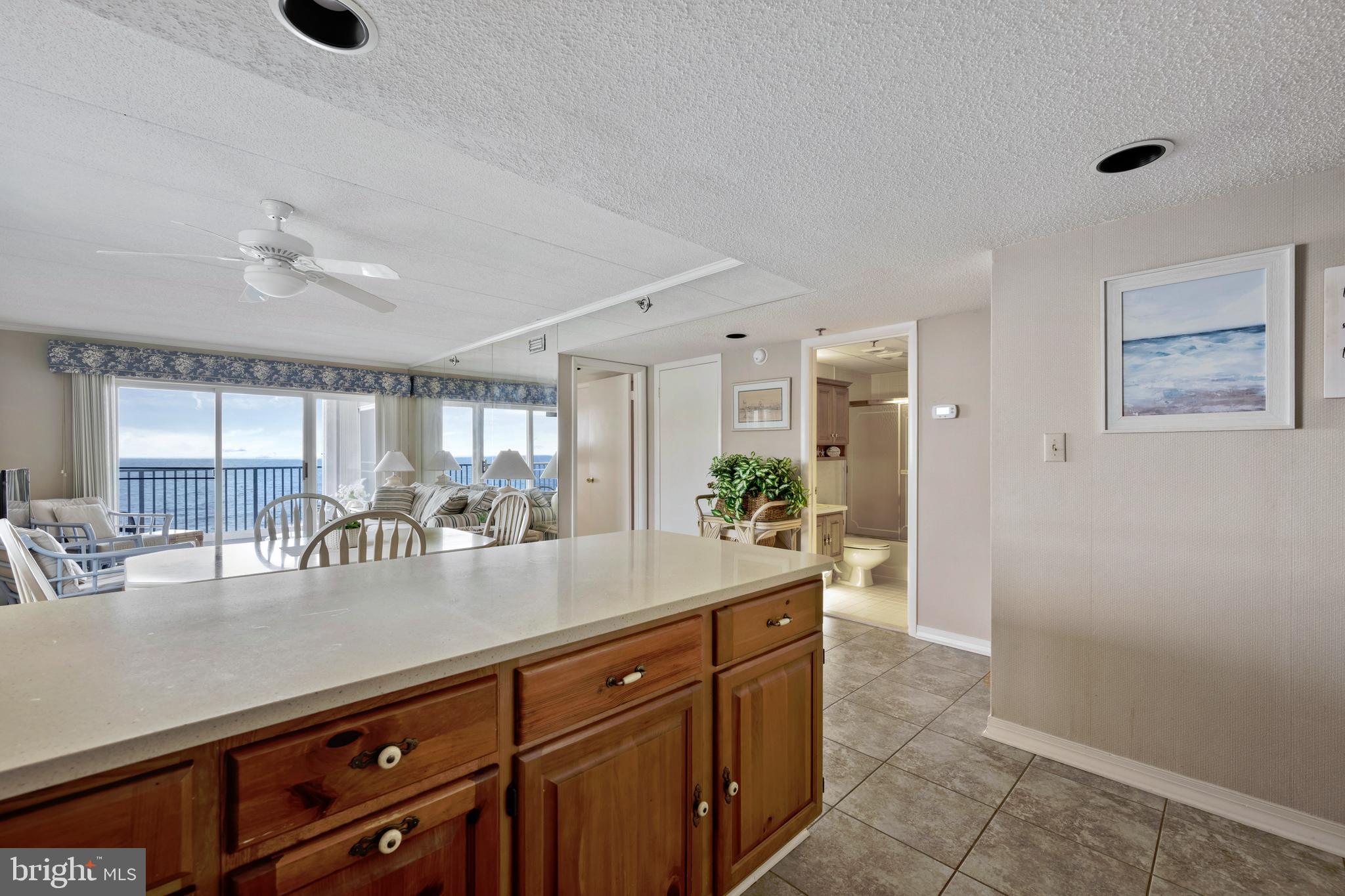 5 77th Street, Unit 404 Ocean City, MD 21842 - Photo 14 of 28 a kitchen with granite countertop a sink and cabinets