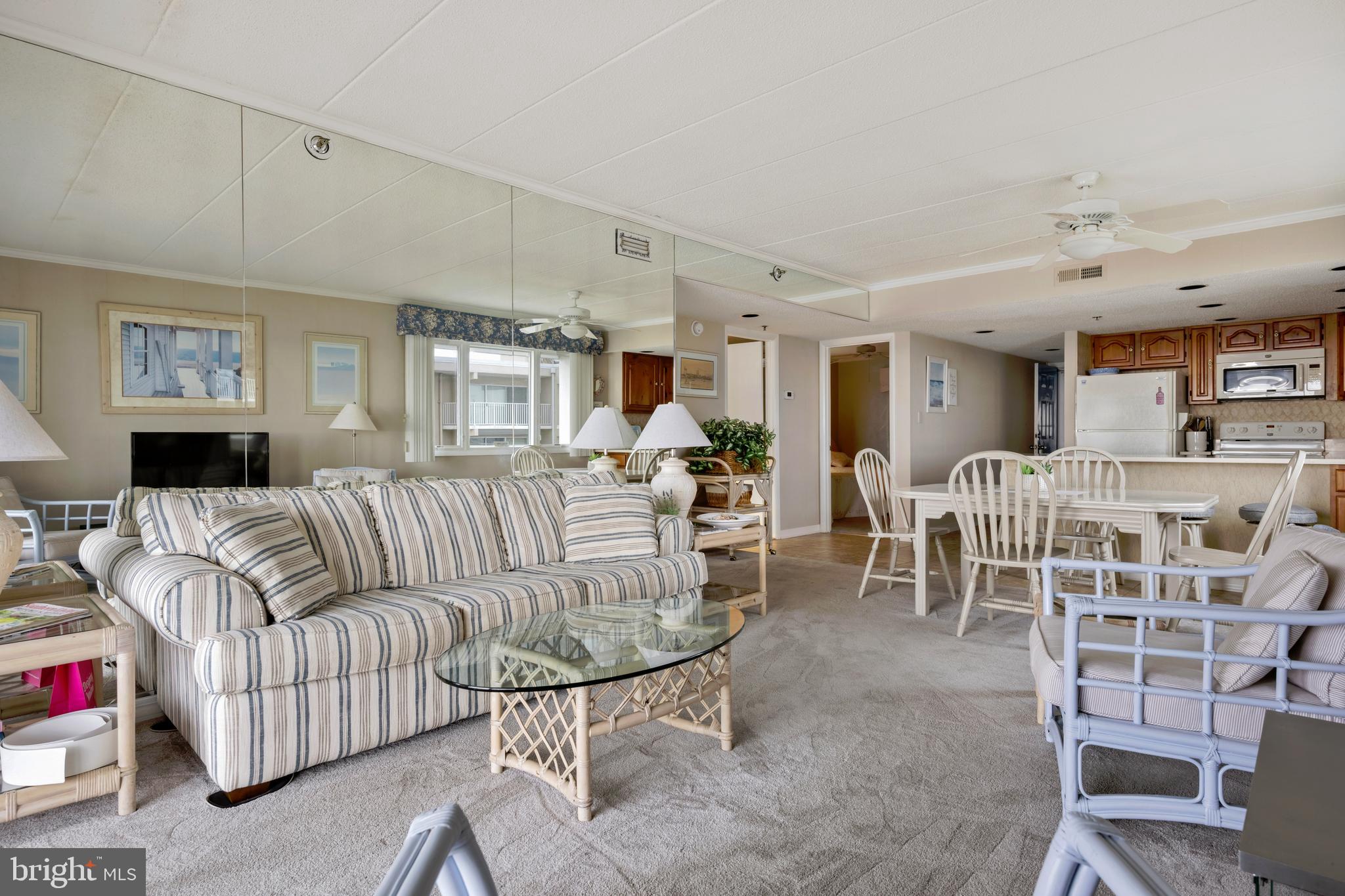 5 77th Street, Unit 404 Ocean City, MD 21842 - Photo 17 of 28 a living room with furniture and a large window