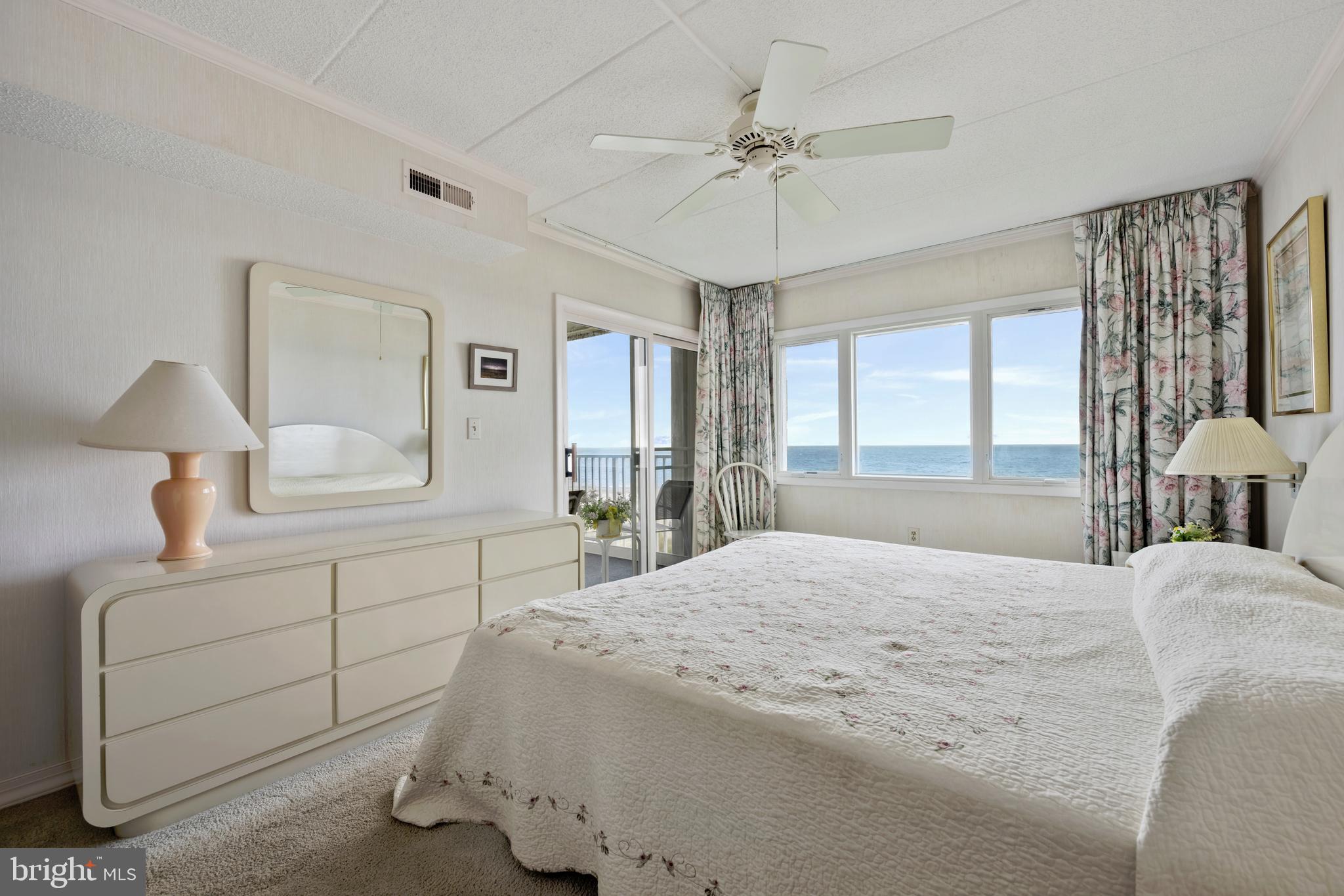 5 77th Street, Unit 404 Ocean City, MD 21842 - Photo 19 of 28 a bedroom with a large bed and a window