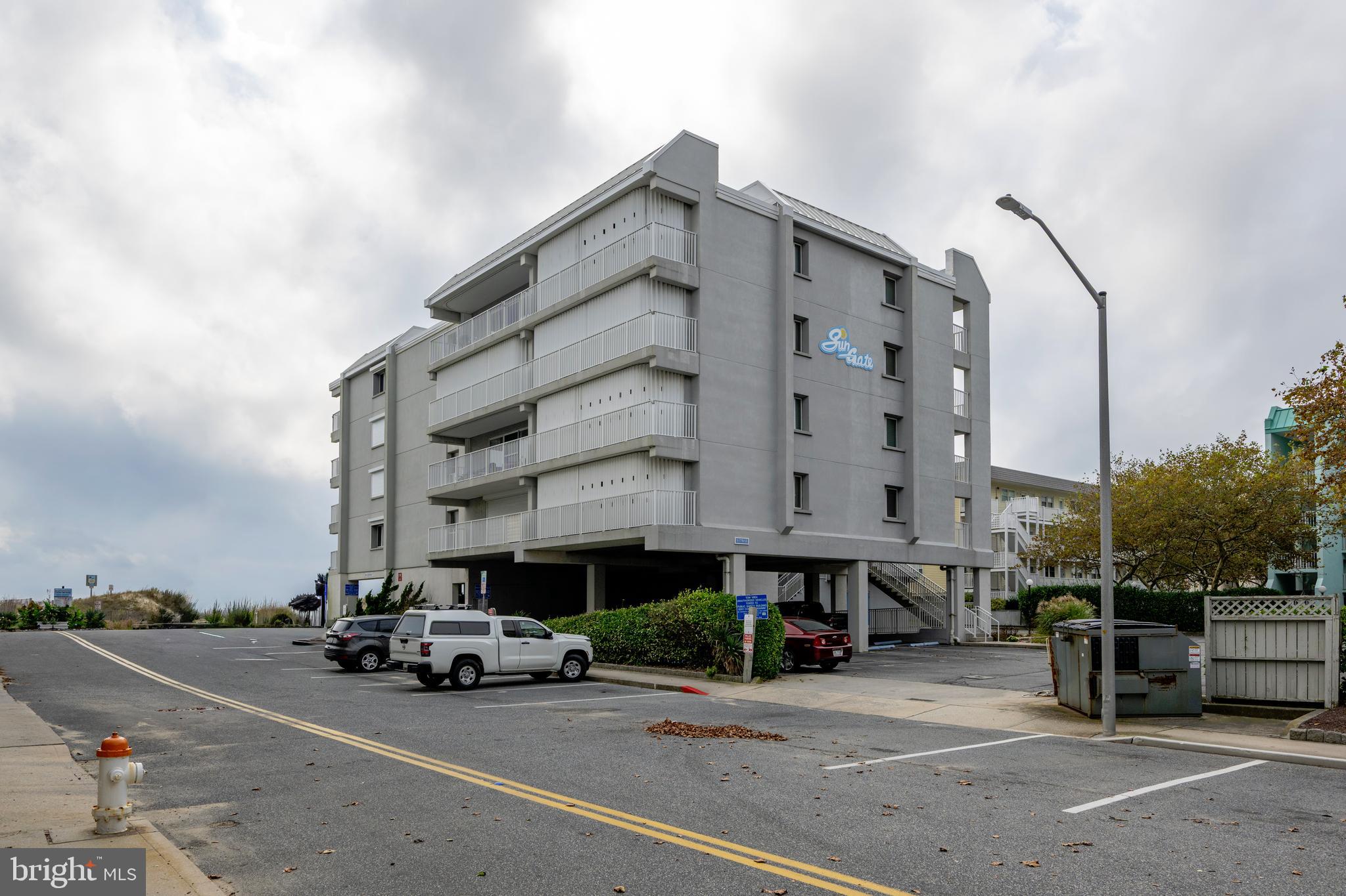 5 77th Street, Unit 404 Ocean City, MD 21842 - Photo 3 of 28 a view of a tall building next to a road